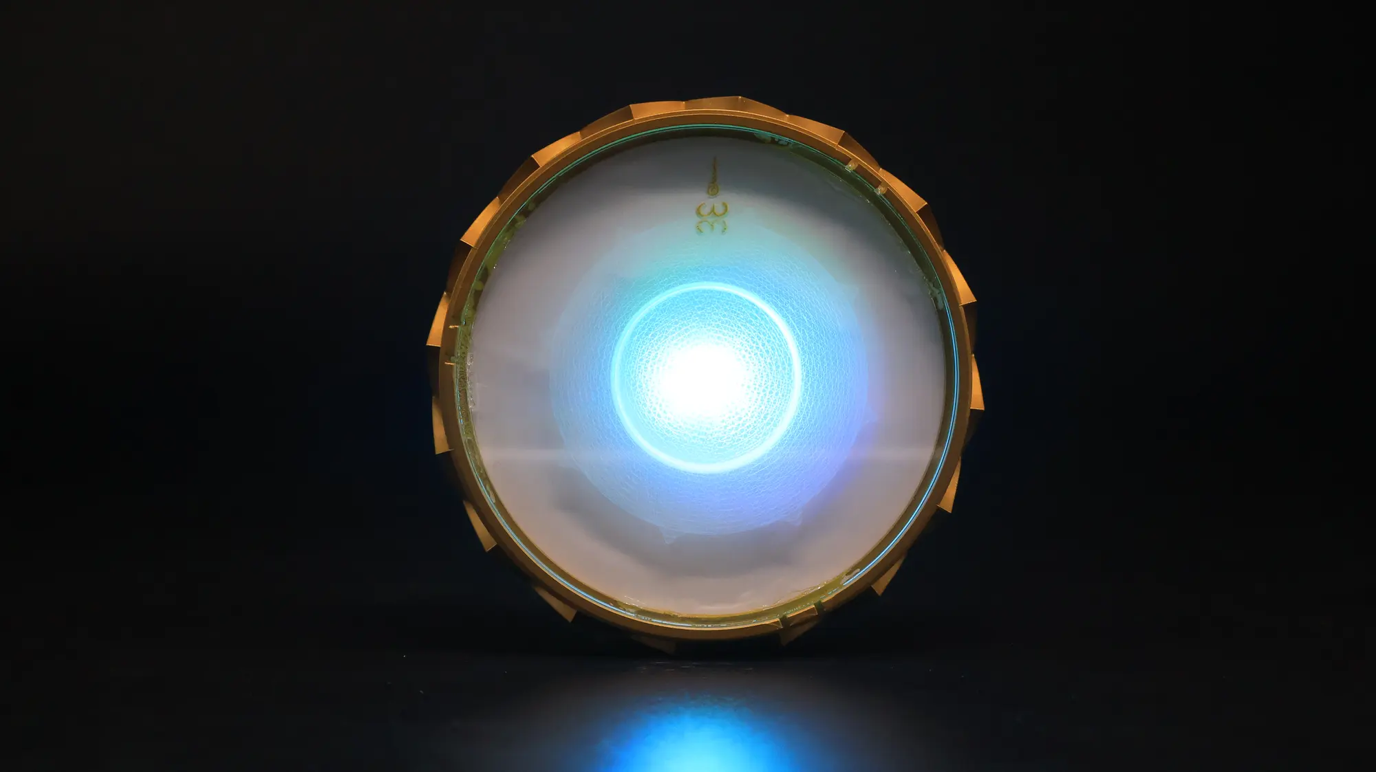 Chakra and Element Activator glowing blue on a dark surface