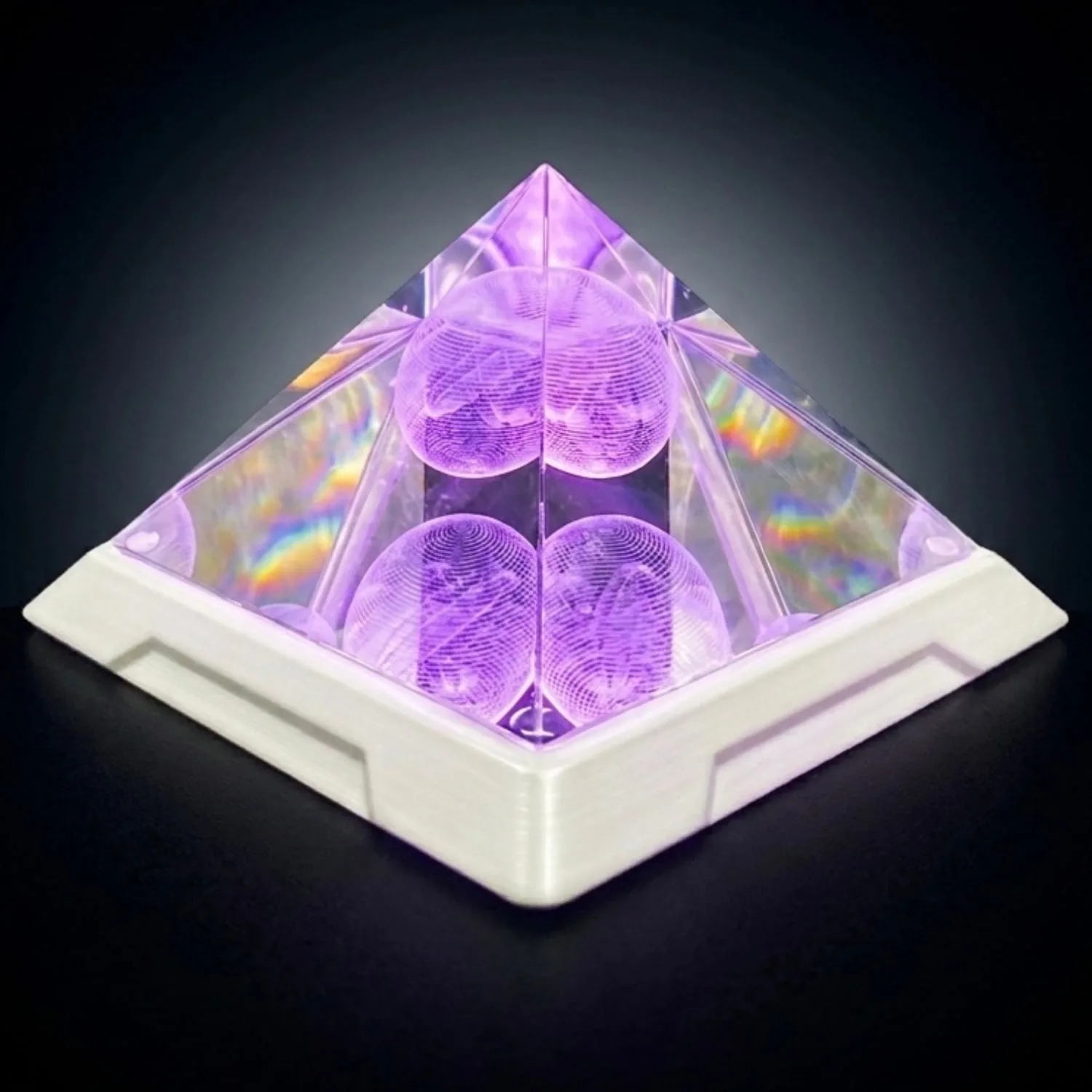 Mandala Resonator crystal pyramid glowing violet during a frequency program