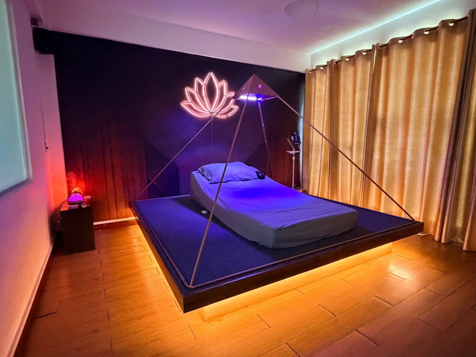 Light Mandalas Luminara Pyramid room with lotus light and warm ambient lighting